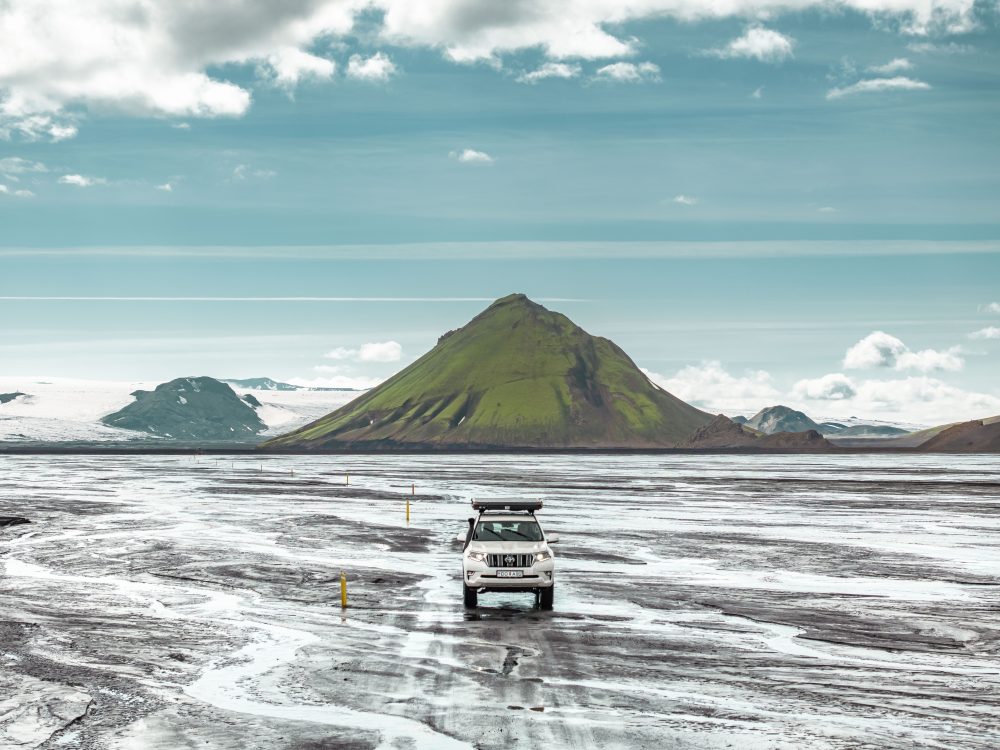 Toyota Land Cruiser with a rooftop tent at Mælifell mountain.