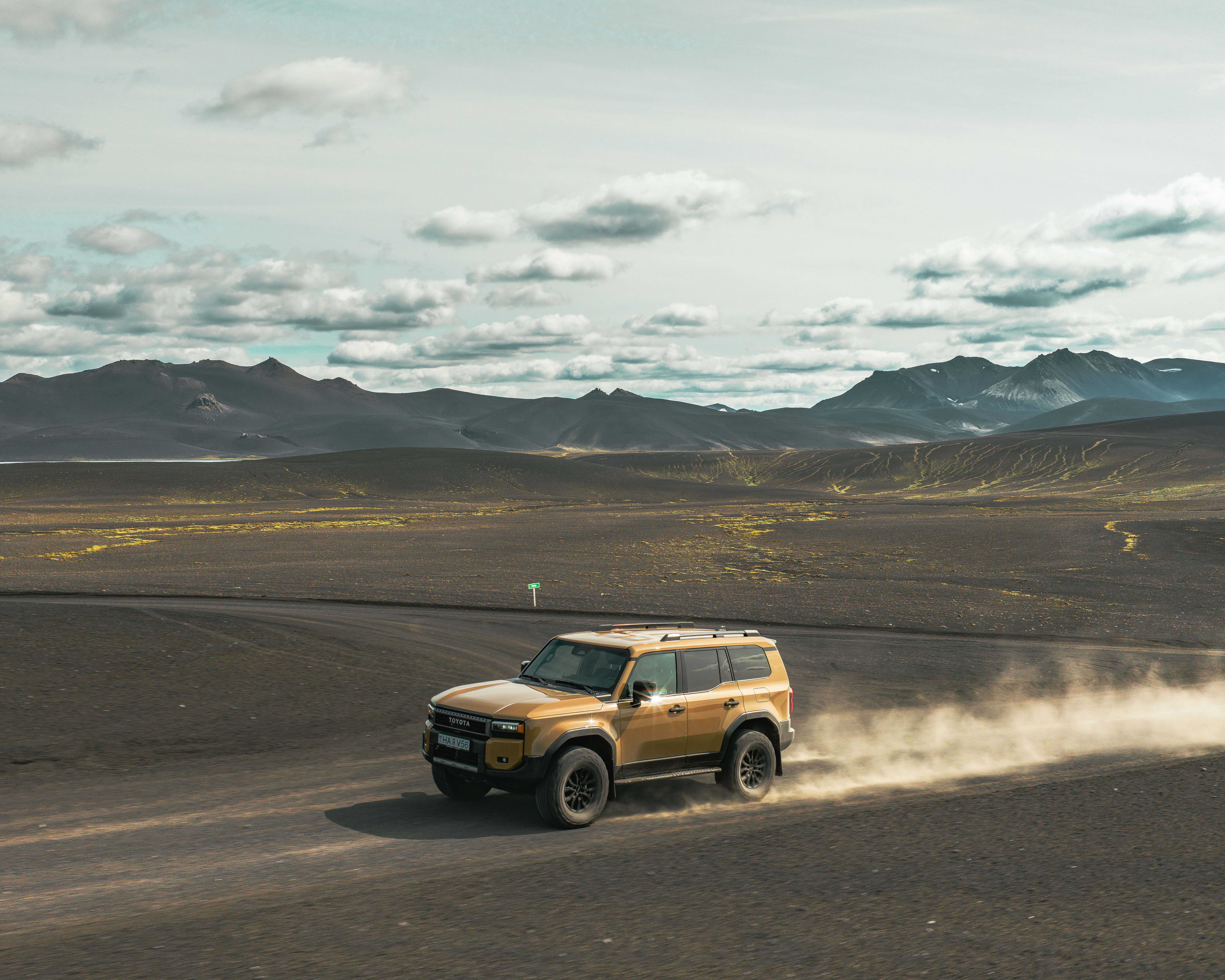 Modified Toyota Land Cruiser exploring the remote volcanic landscapes of the Iceland Highlands.